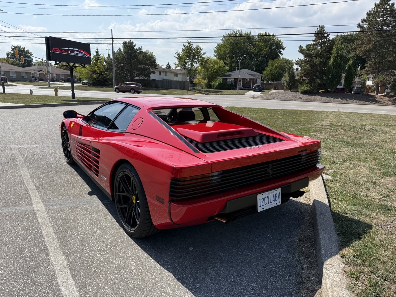Red Ferrari parked at Redline Autohaus