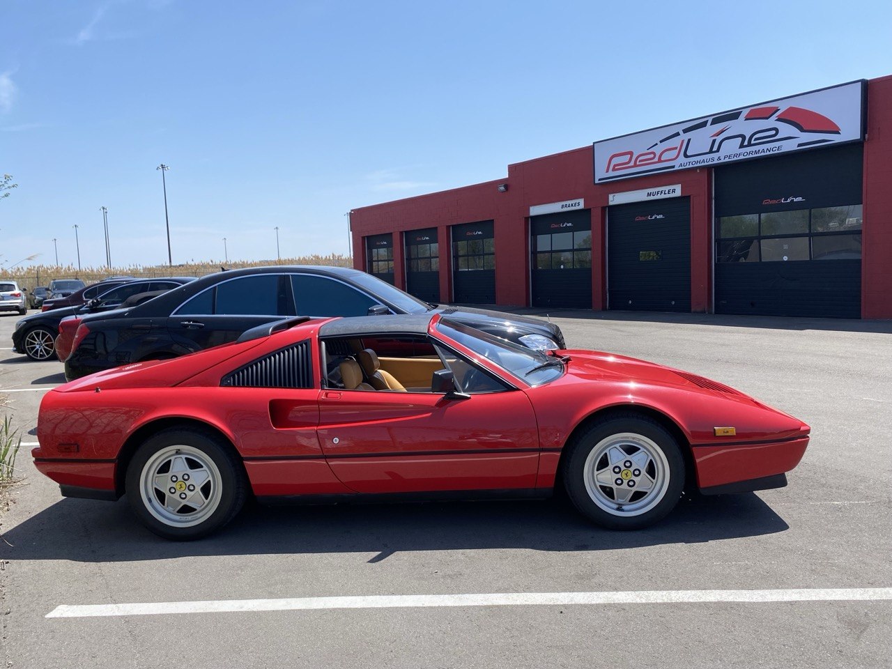 Red Ferrari outside Redline Autohaus