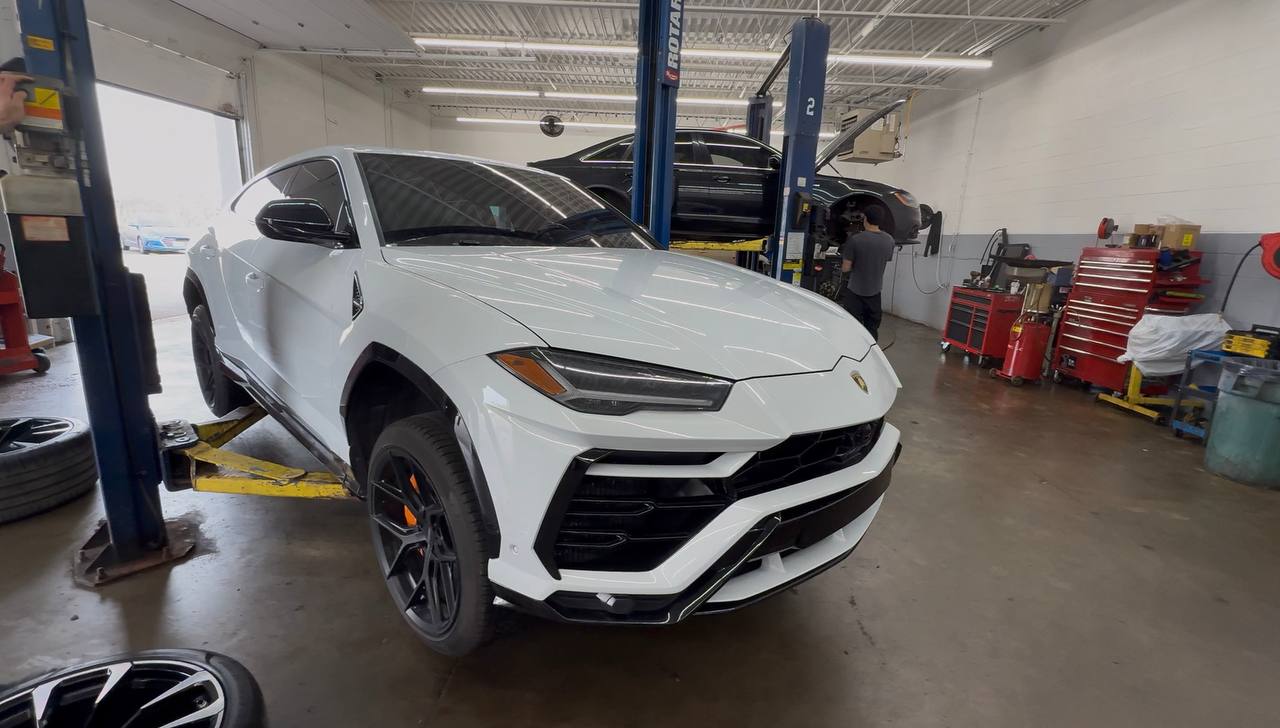 White Lamborghini Urus in the workshop